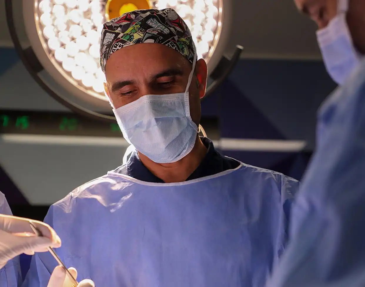 Surgeon Dr. Bilgi Baca focused during an operation, representing expert and personalized surgical care at BB Global Health